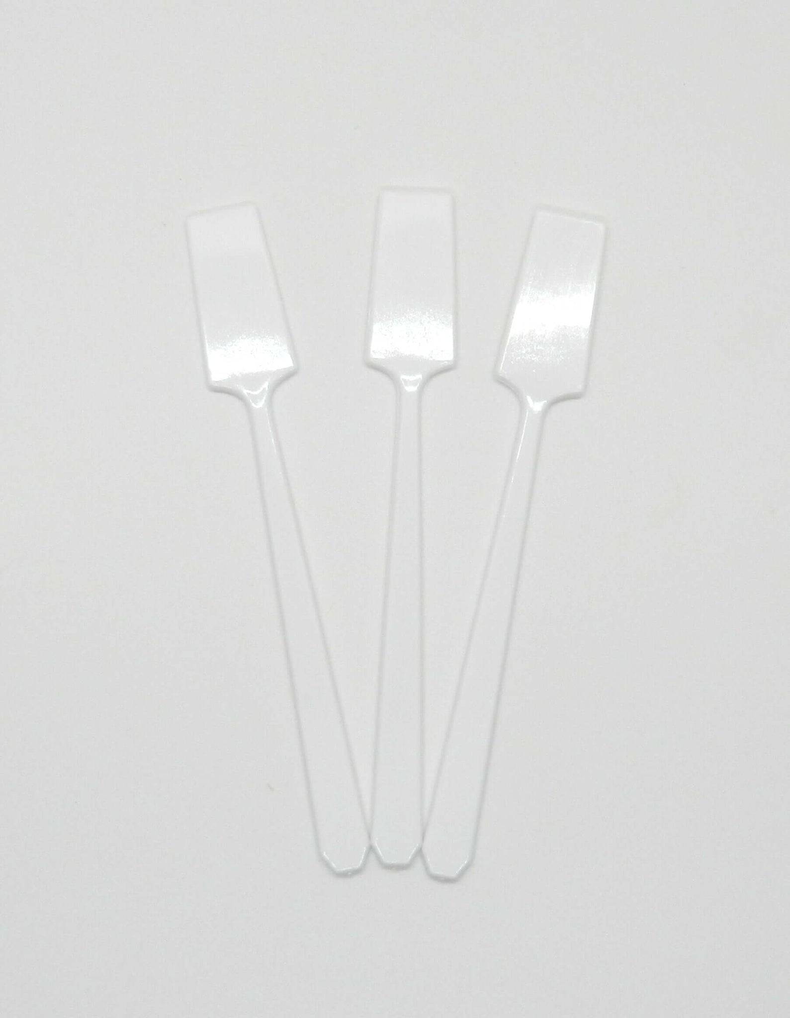 3 white spatulas