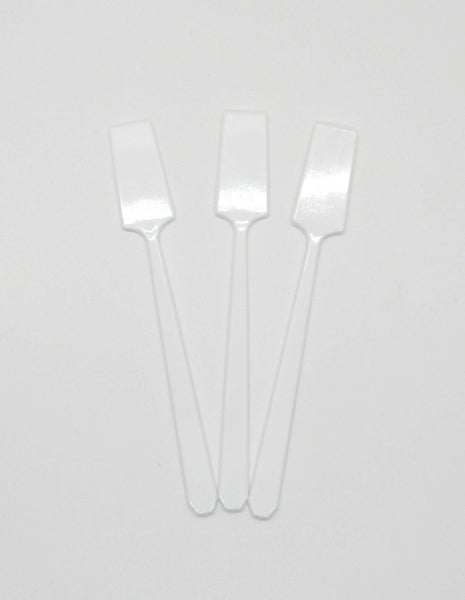 3 white spatulas