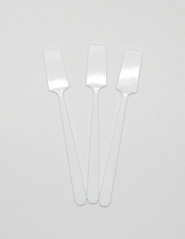 3 white spatulas