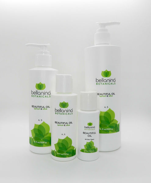 a 2 oz. and a 4 oz. and an 8 oz. and a 16 oz. bottle of Beautiful Oil